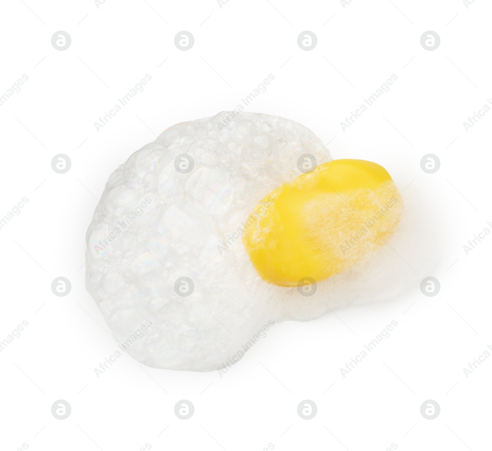 Photo of Yellow soap with foam on white background, top view