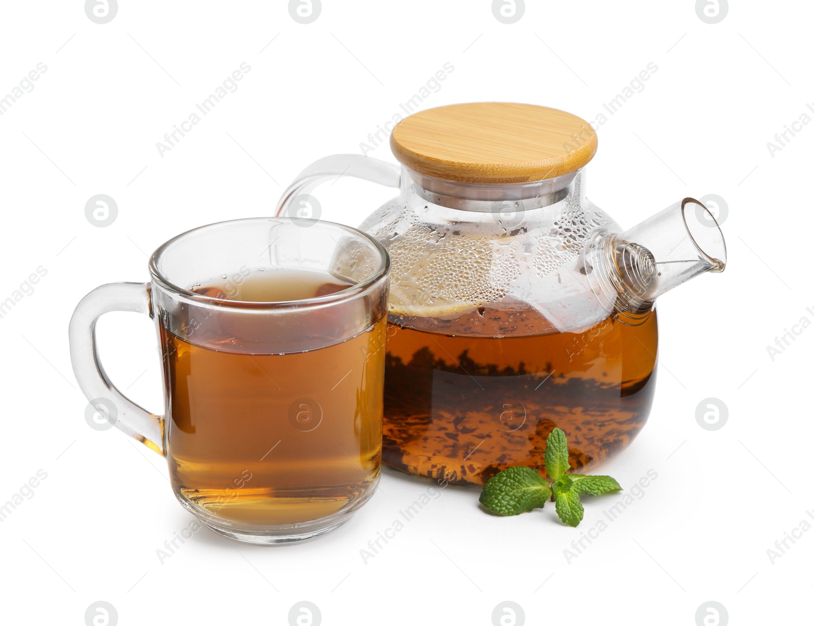 Photo of Tasty mint tea and fresh leaves isolated on white