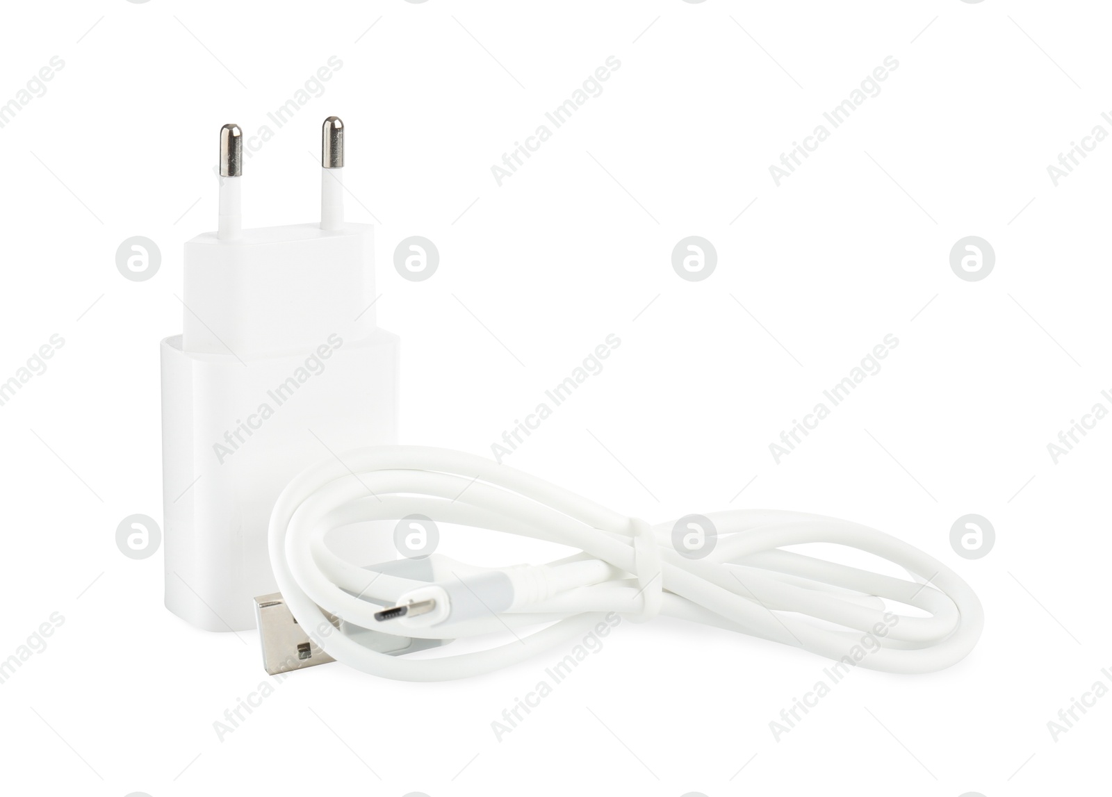 Photo of USB power adapter and charge cable isolated on white