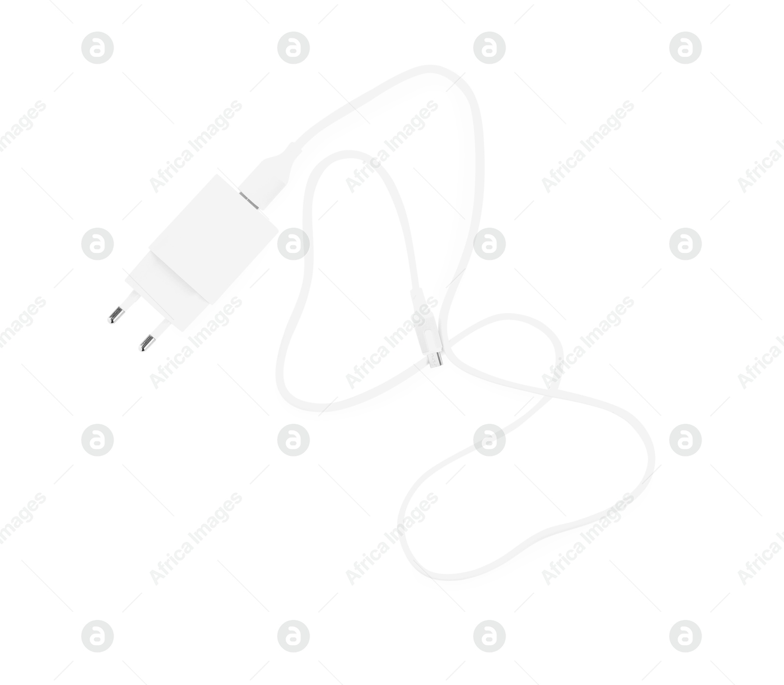 Photo of USB power adapter with charge cable isolated on white, top view