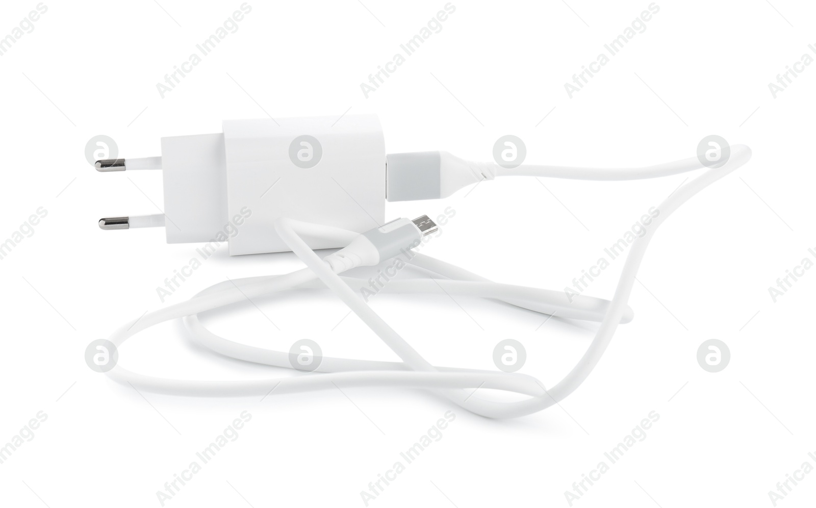 Photo of USB power adapter with charge cable isolated on white