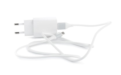 Photo of USB power adapter with charge cable isolated on white