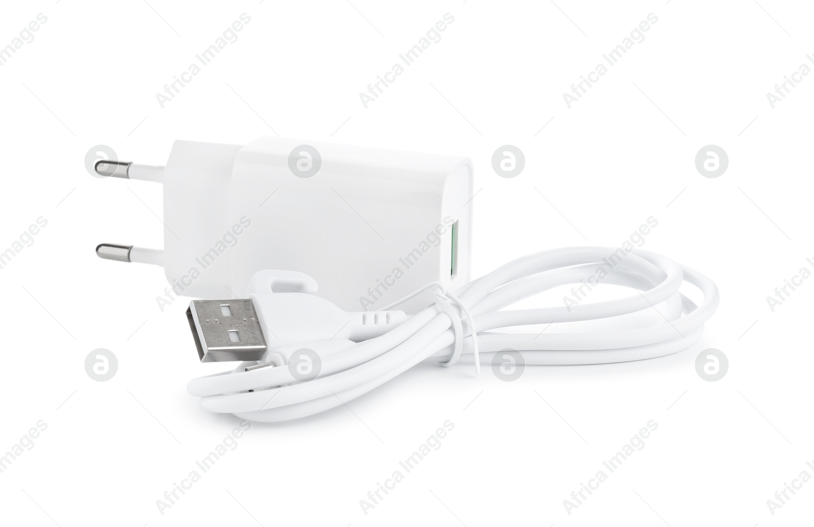 Photo of USB power adapter and charge cable isolated on white