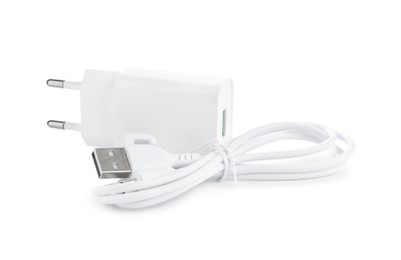 USB power adapter and charge cable isolated on white