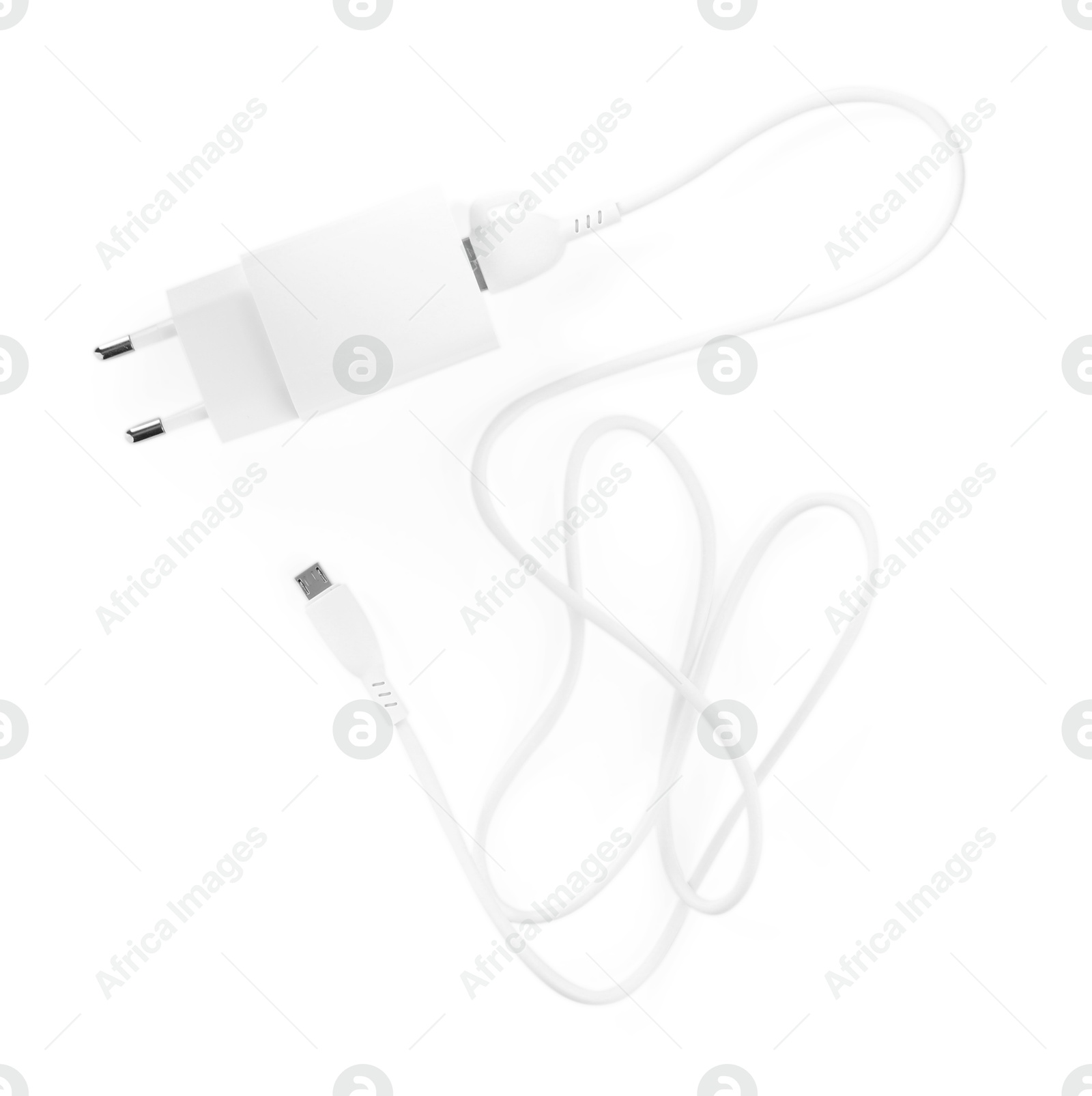 Photo of USB power adapter with charge cable isolated on white, top view