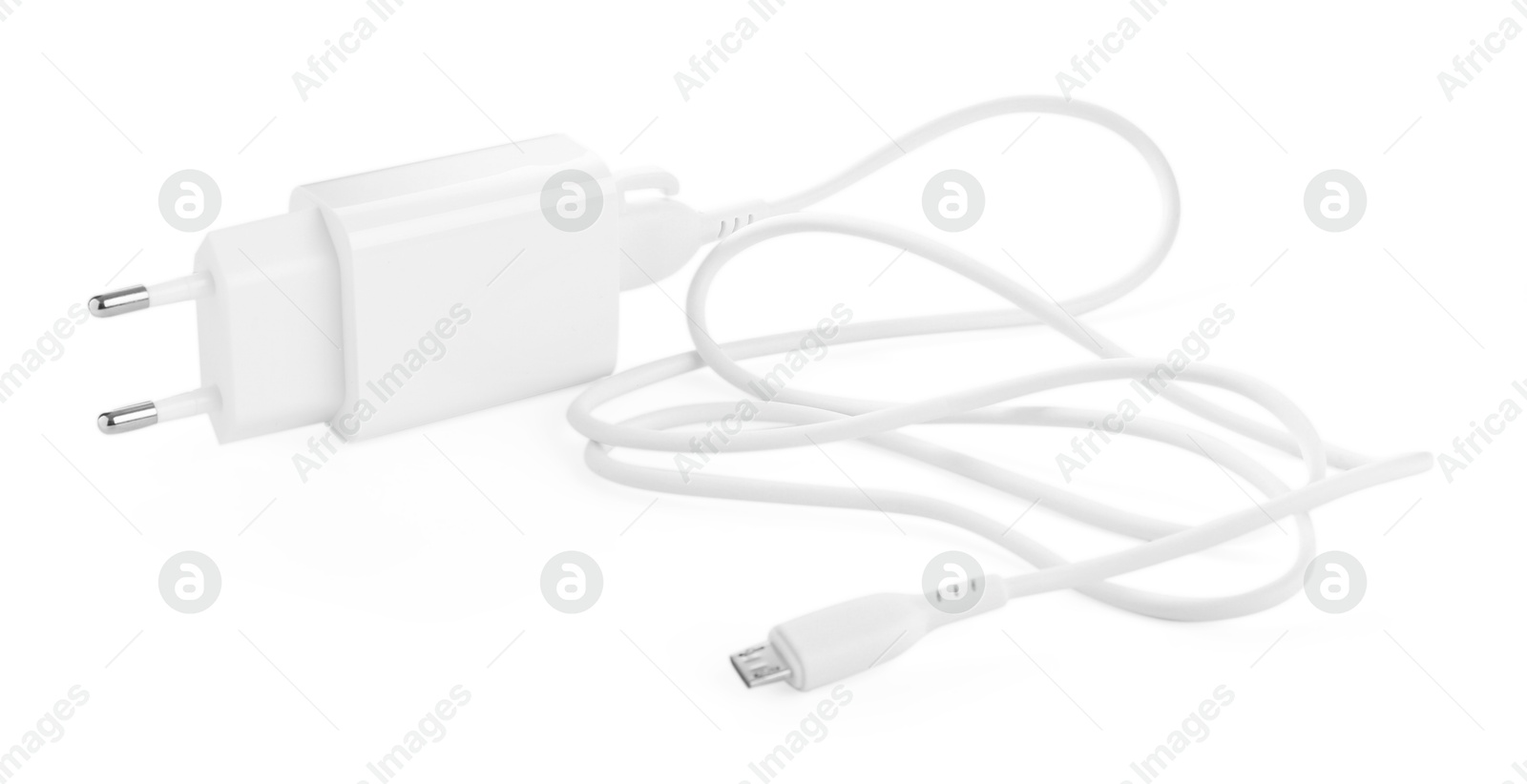 Photo of USB power adapter with charge cable isolated on white