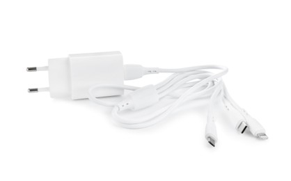 Photo of USB power adapter with triple charge cable isolated on white