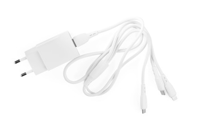 Photo of USB power adapter with triple charge cable isolated on white, top view