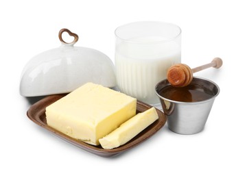 Photo of Fresh milk in glass, honey and butter isolated on white