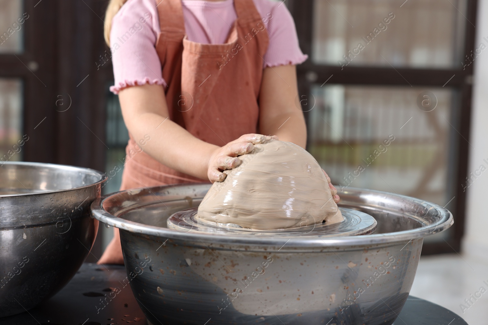 Photo of Hobby and craft. Girl making pottery indoors, closeup