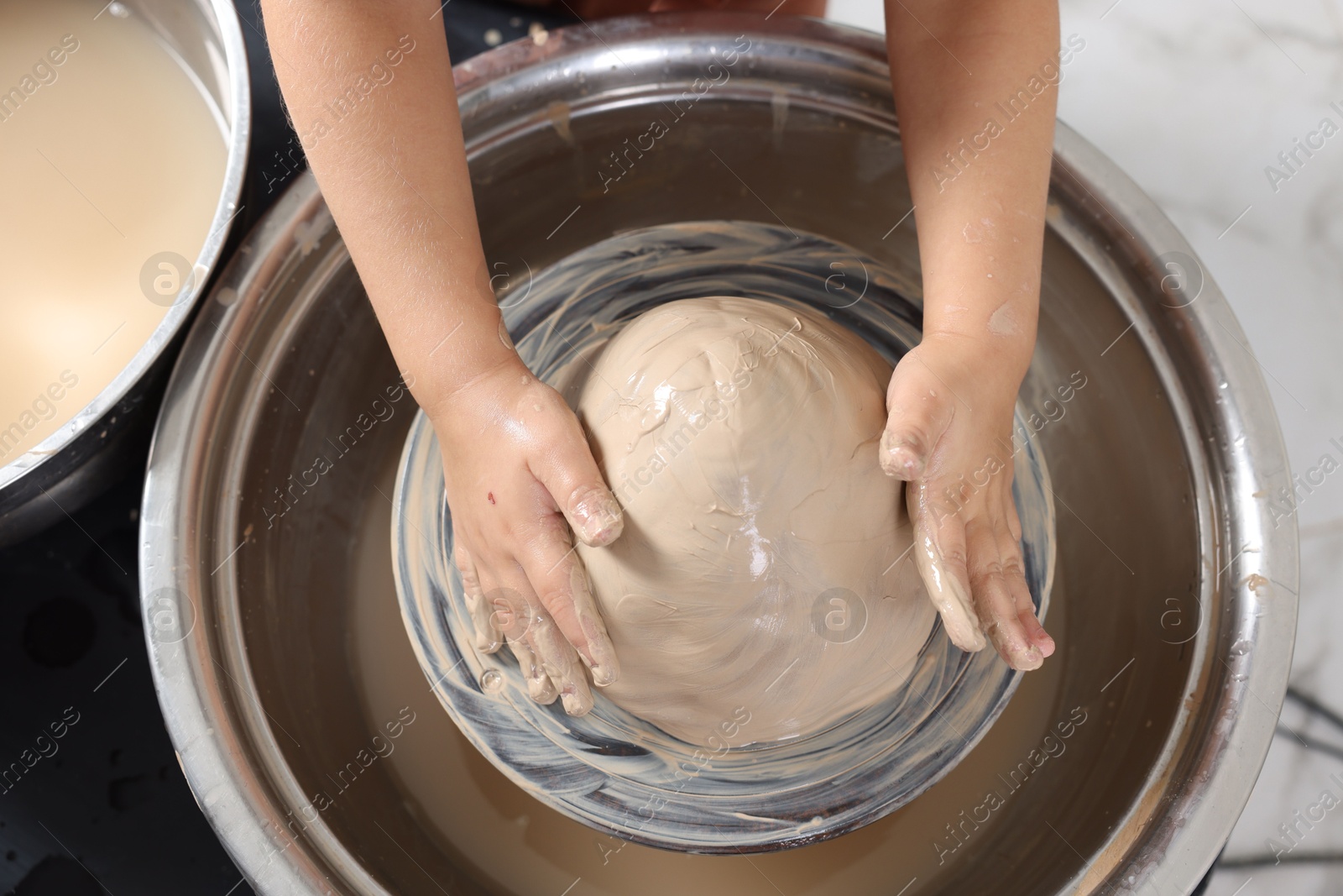 Photo of Hobby and craft. Girl making pottery indoors, above view