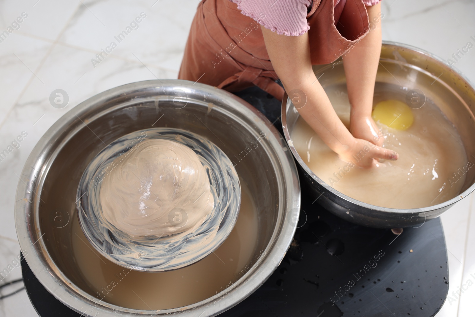 Photo of Hobby and craft. Girl making pottery indoors, closeup