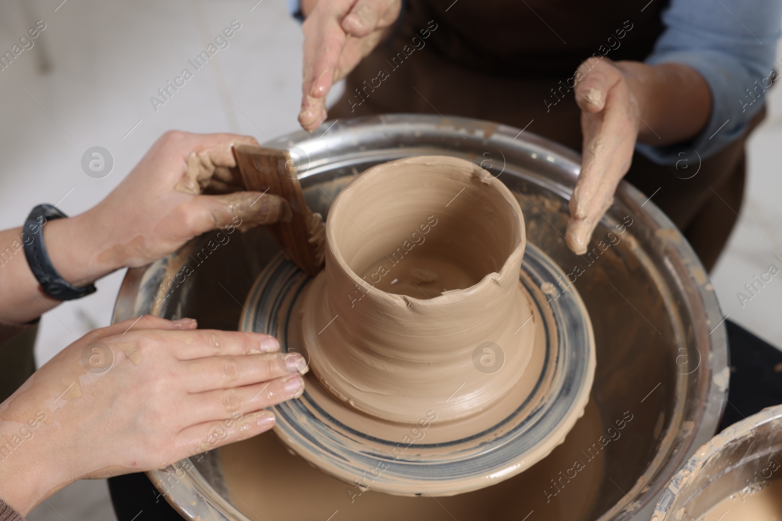 Photo of Hobby and craft. Women making pottery indoors, closeup