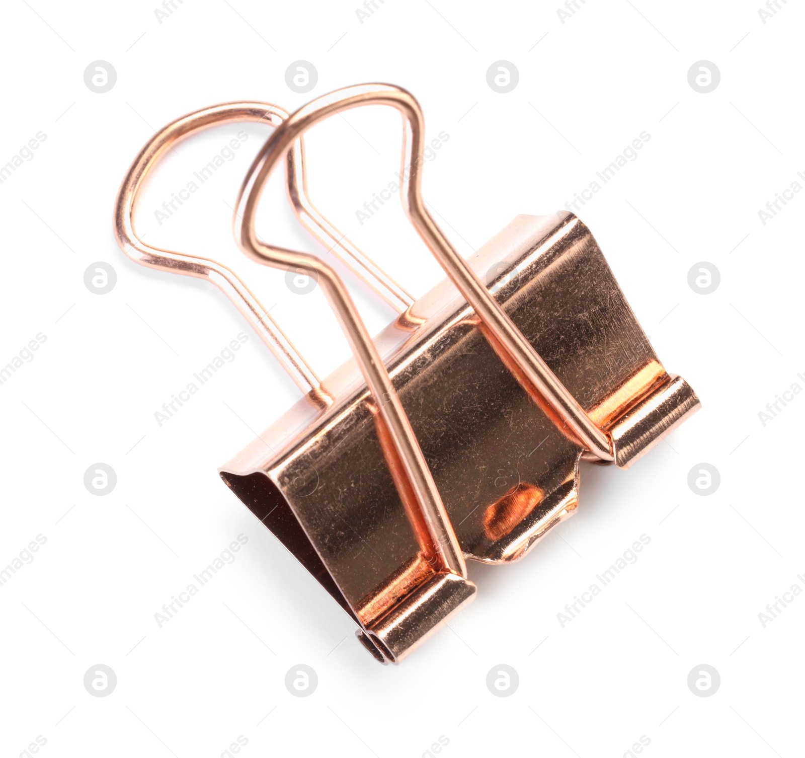 Photo of One golden binder clip isolated on white, top view