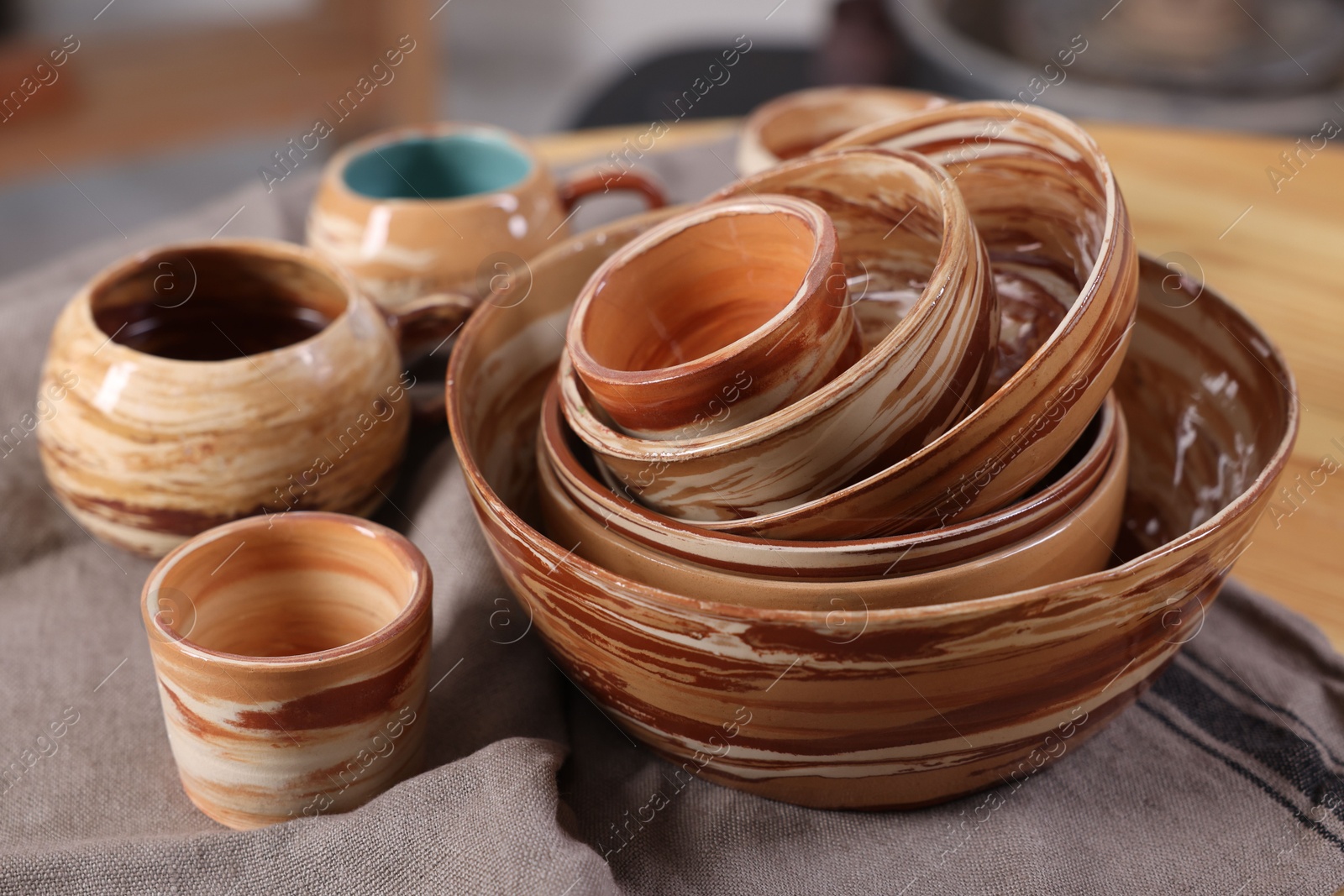 Photo of Different beautiful pottery on table indoors, closeup