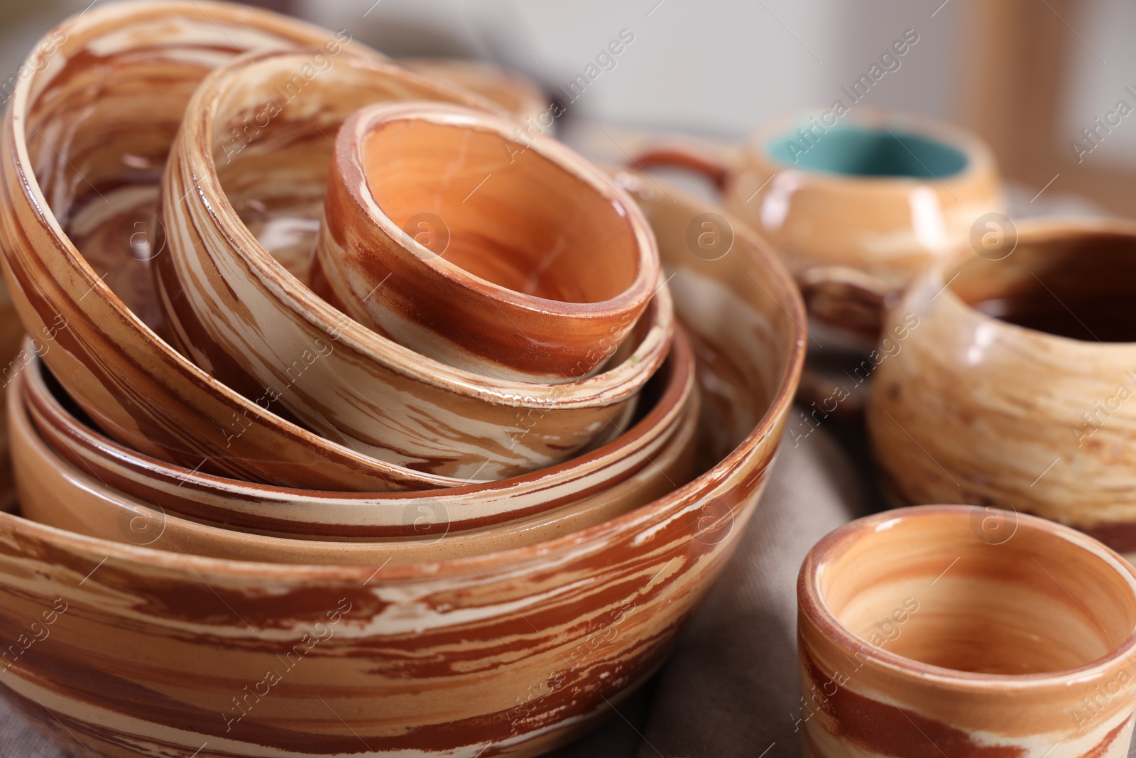 Photo of Different beautiful pottery on table indoors, closeup