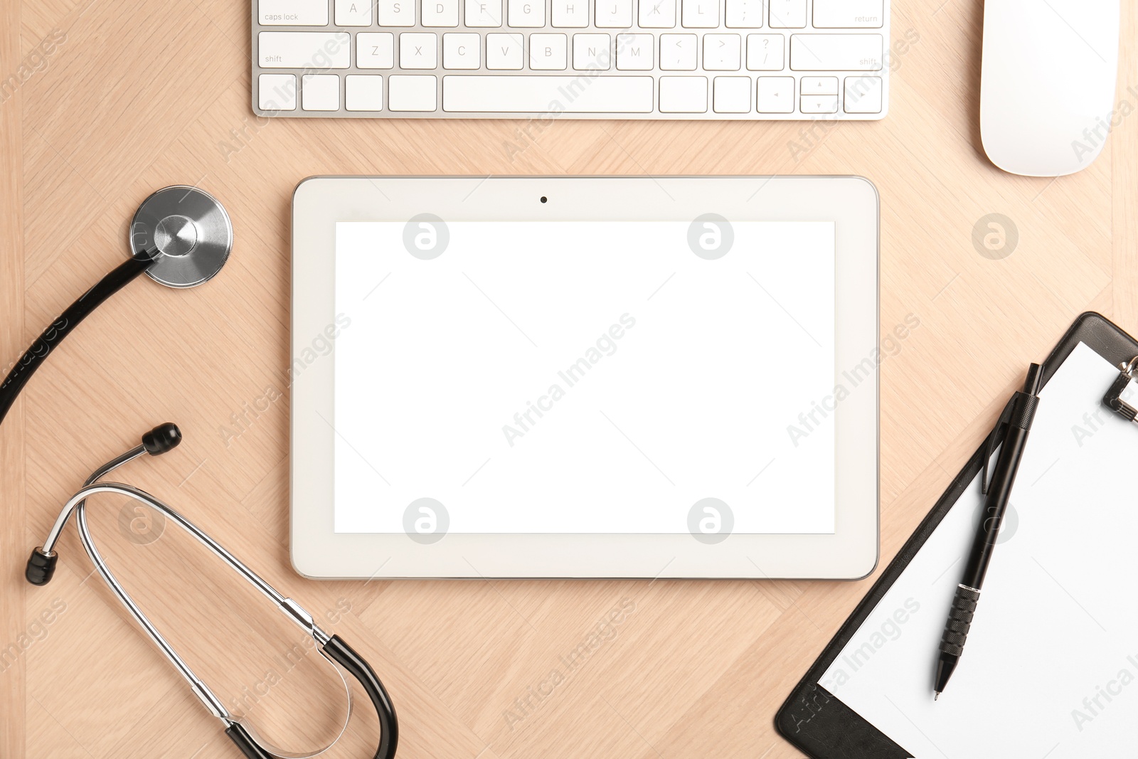 Photo of Cardiology. Flat lay composition with stethoscope and tablet on wooden table