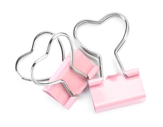 Photo of Heart shaped binder clips isolated on white, top view