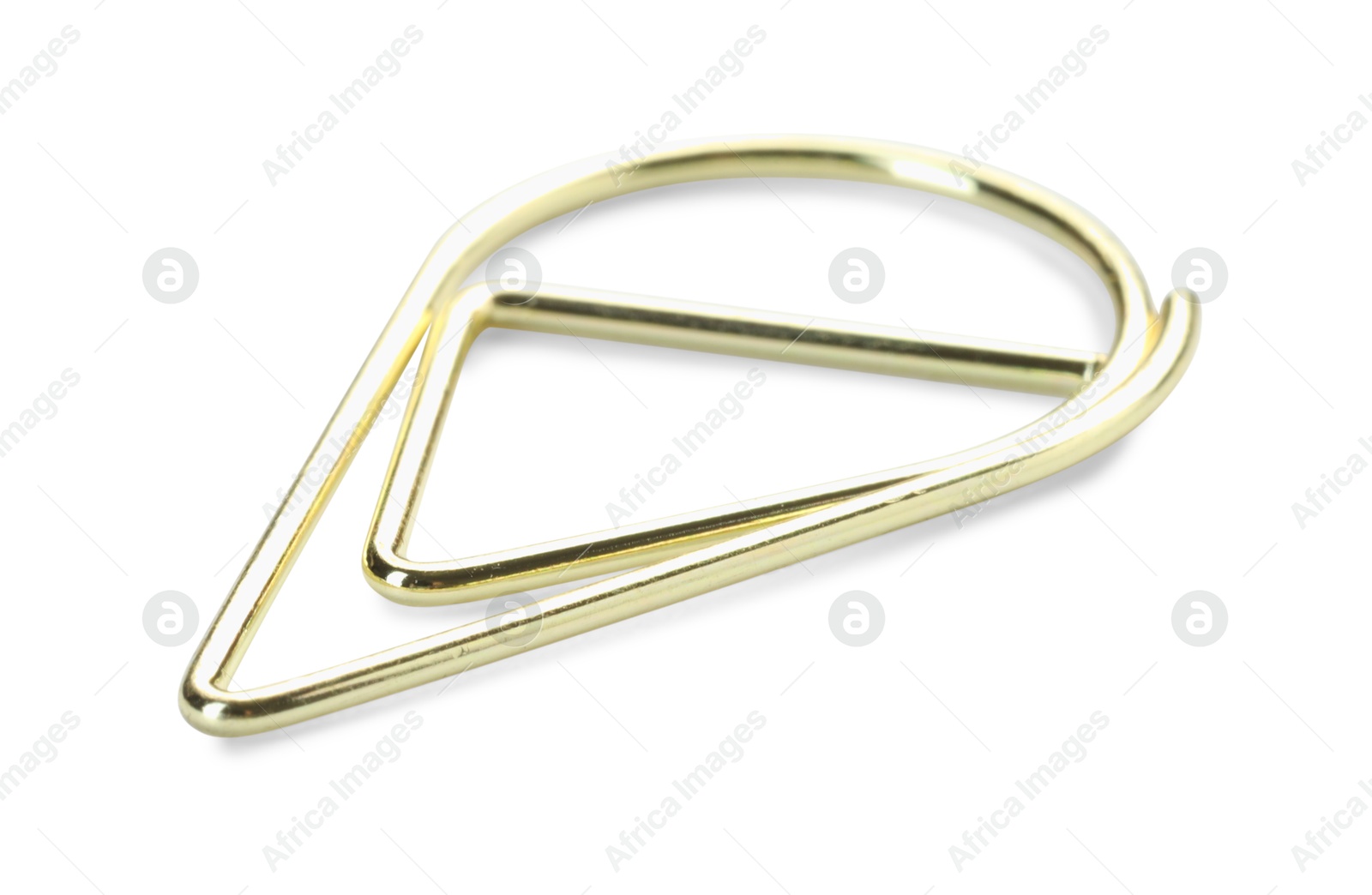 Photo of One golden paper clip isolated on white