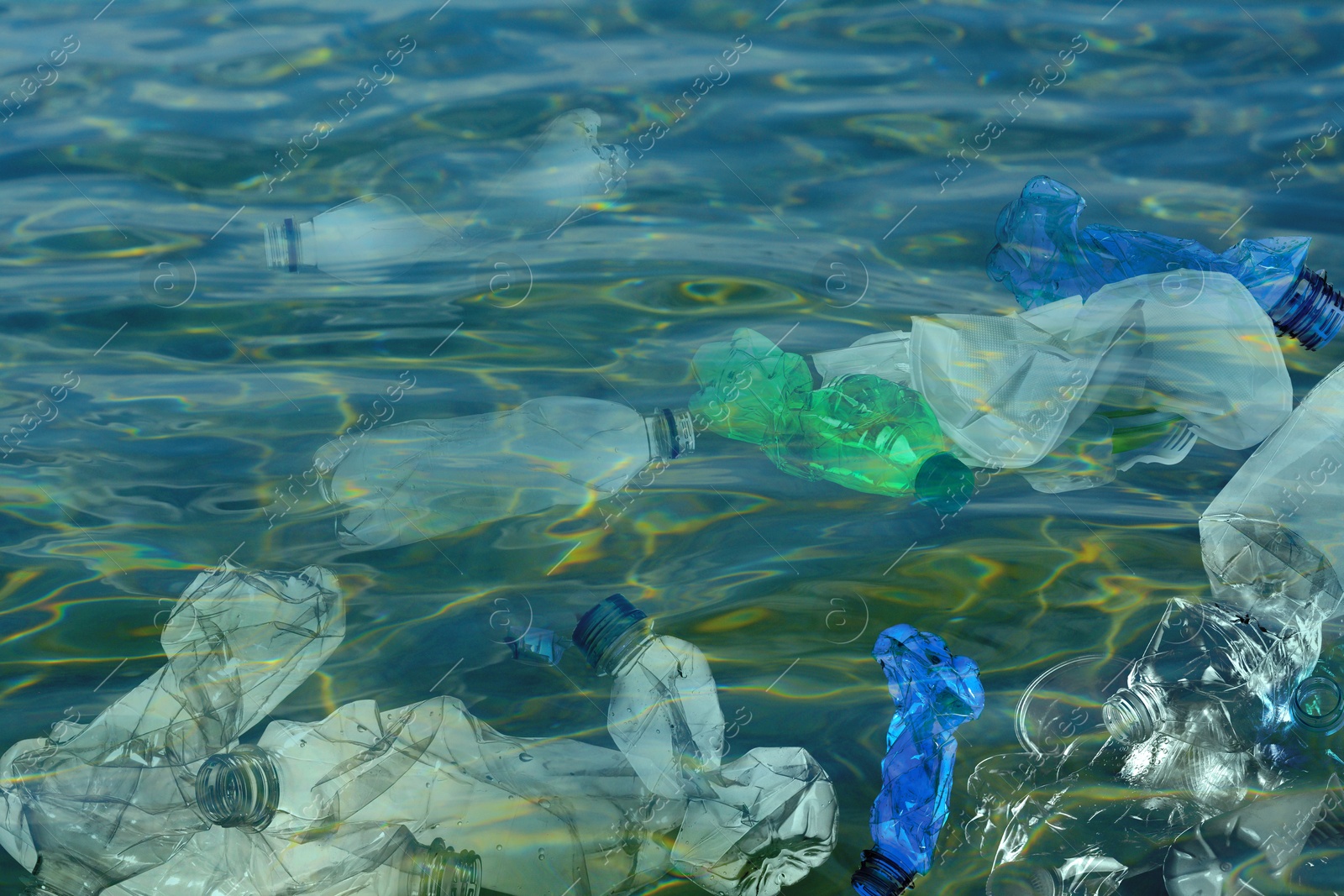 Image of Environmental pollution. Ocean water with plastic garbage