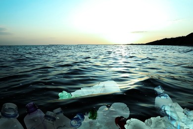 Image of Environmental pollution. Ocean water with plastic garbage