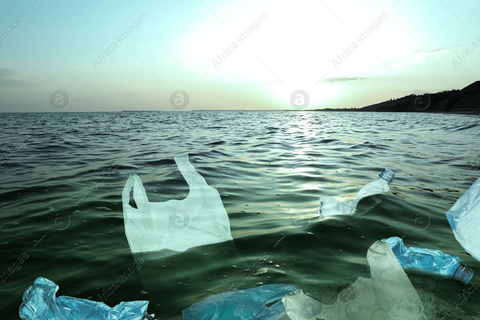 Image of Environmental pollution. Sea water with plastic garbage