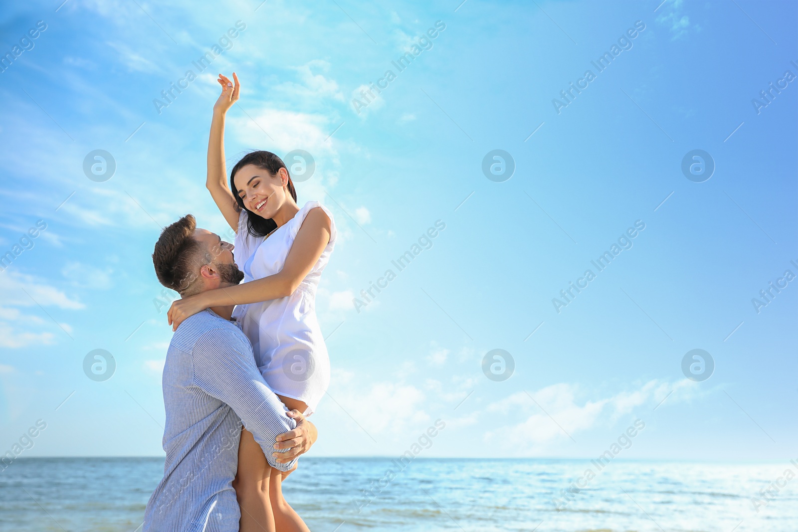 Photo of Happy young couple having fun on beach