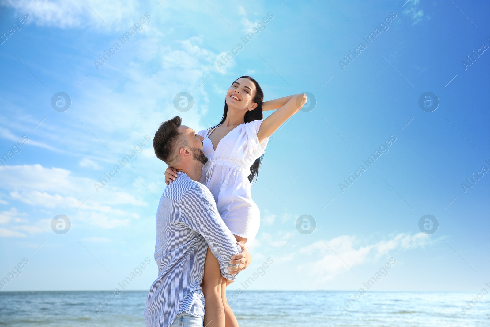 Photo of Happy young couple having fun on beach