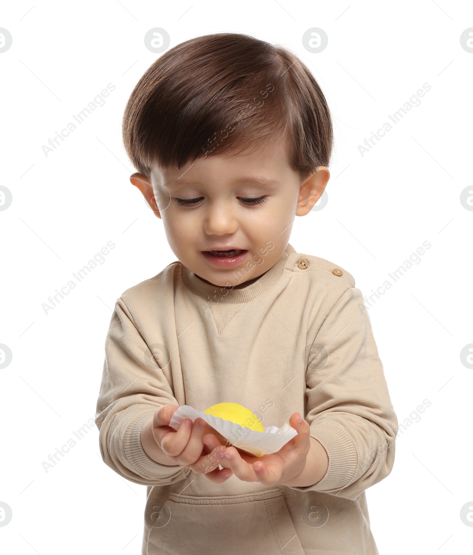 Photo of Cute little child with tasty mochi on white background