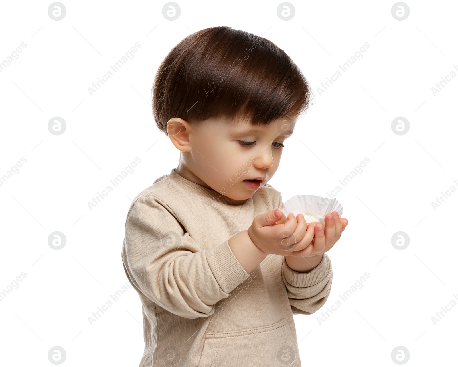 Photo of Cute little child with tasty mochi on white background