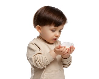 Photo of Cute little child with tasty mochi on white background