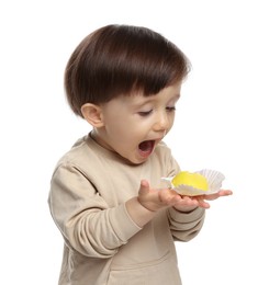 Photo of Cute little child with tasty mochi on white background