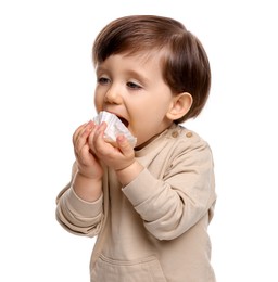 Photo of Cute little child eating tasty mochi on white background