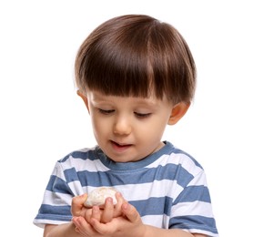 Photo of Cute little child with tasty mochi on white background