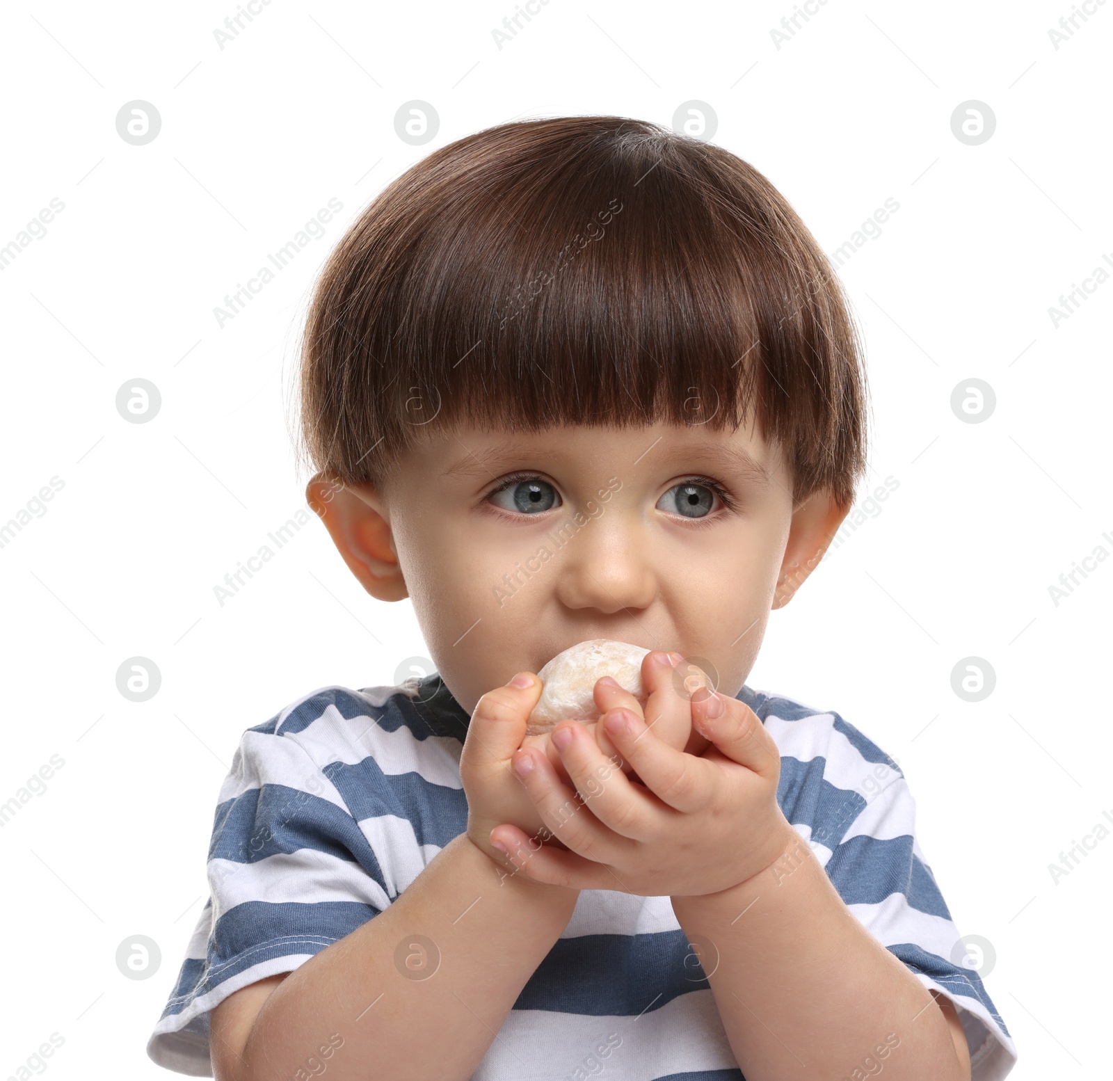 Photo of Cute little child eating tasty mochi on white background