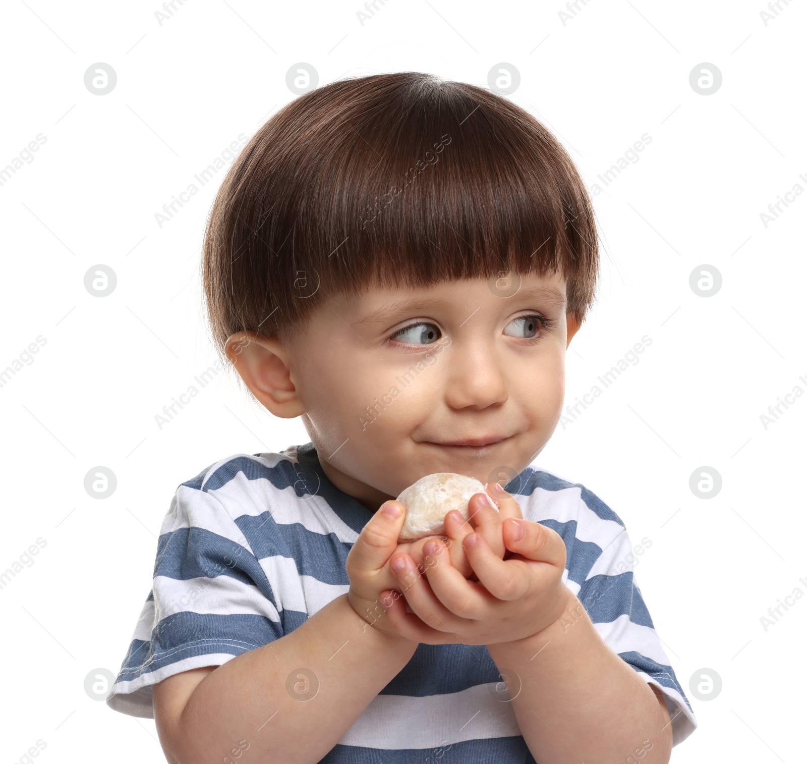 Photo of Cute little child eating tasty mochi on white background