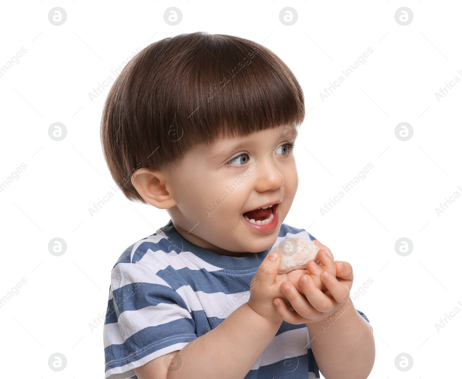 Photo of Cute little child eating tasty mochi on white background