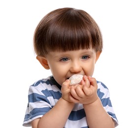 Photo of Cute little child eating tasty mochi on white background