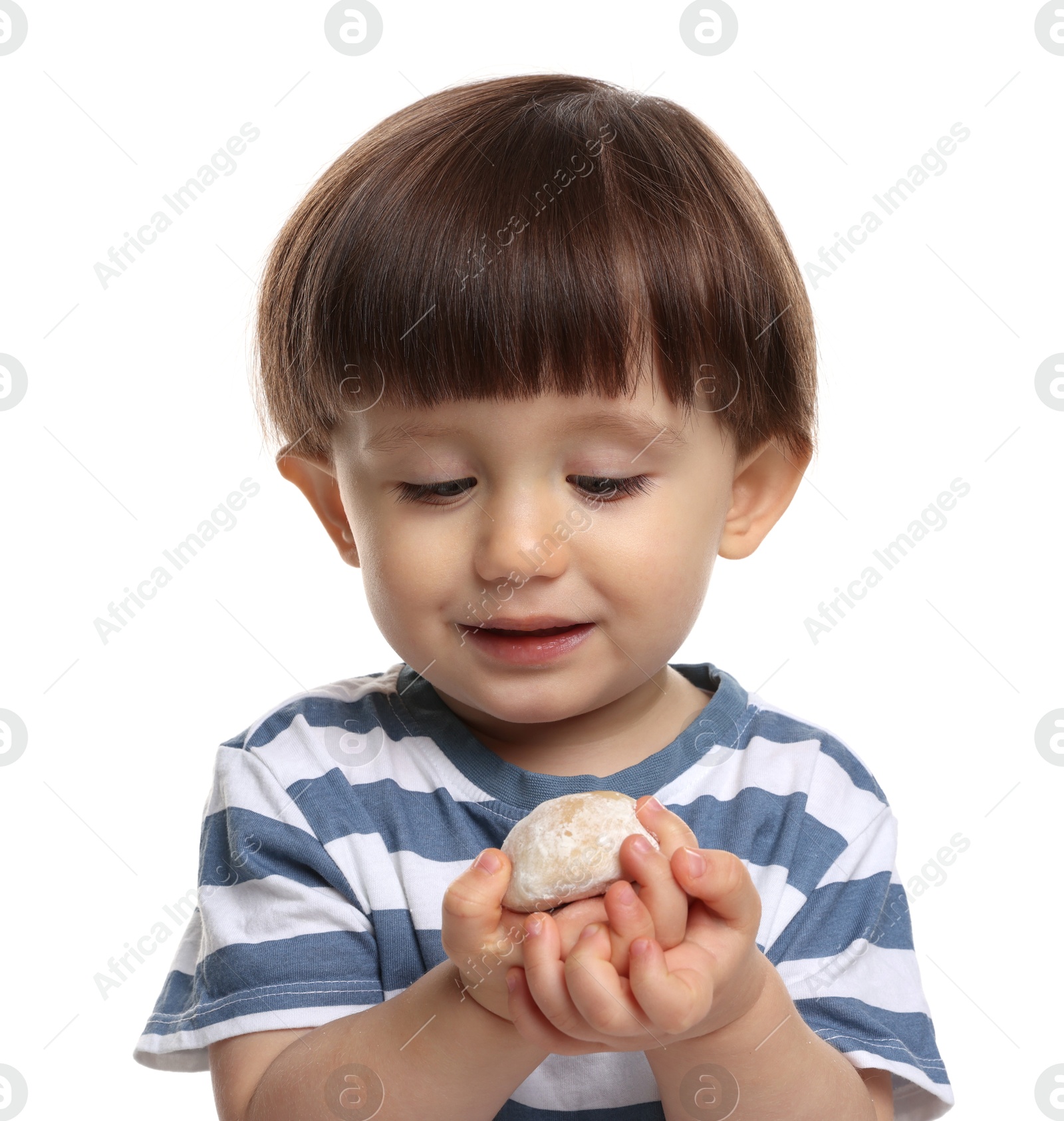 Photo of Cute little child with tasty mochi on white background