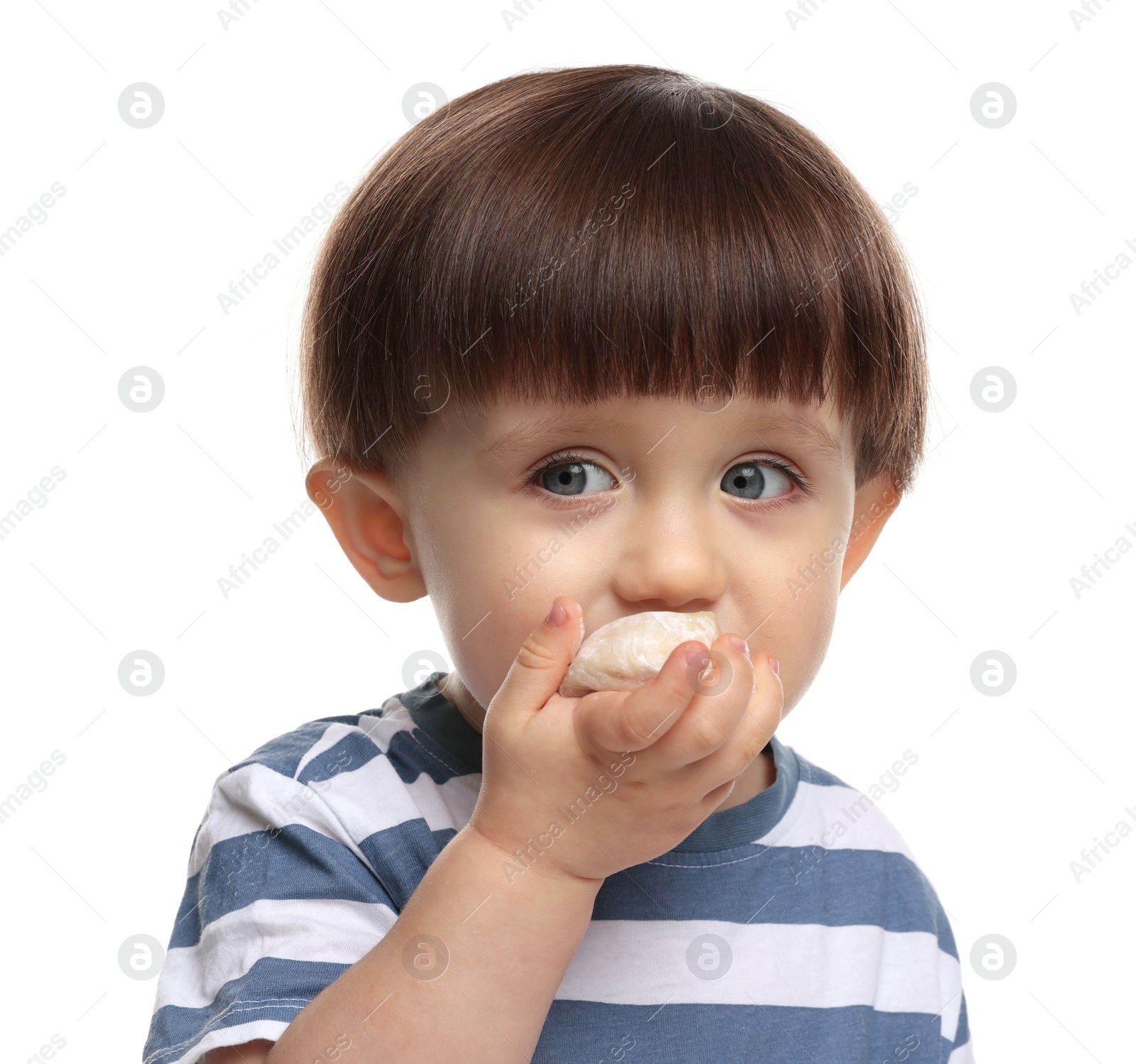 Photo of Cute little child eating tasty mochi on white background