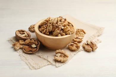 Photo of Peeled walnuts in bowl on light table