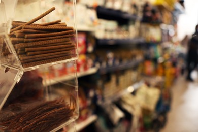 Display with treats in pet shop, closeup. Space for text