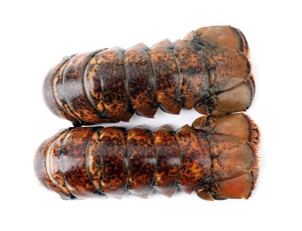 Photo of Two raw lobster tails isolated on white, top view