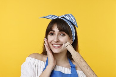 Photo of Happy woman with rolling pin on yellow background