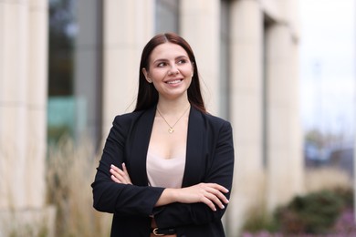 Photo of Beautiful woman in stylish formal suit outdoors