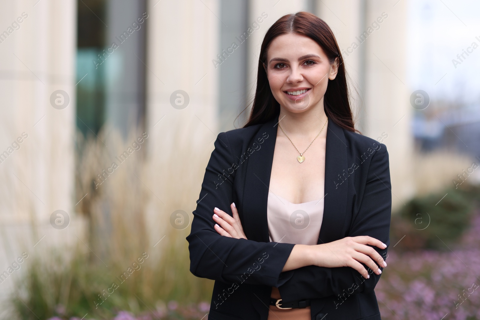 Photo of Beautiful woman in stylish formal suit outdoors