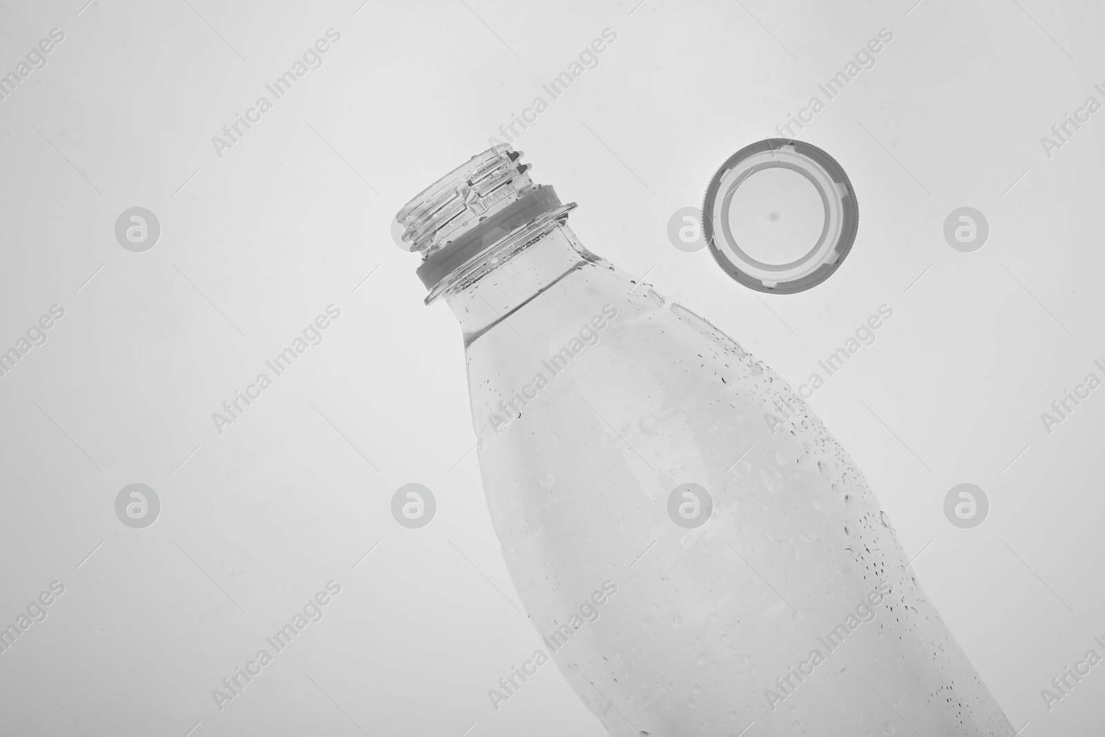 Photo of Empty plastic bottle on white background, top view