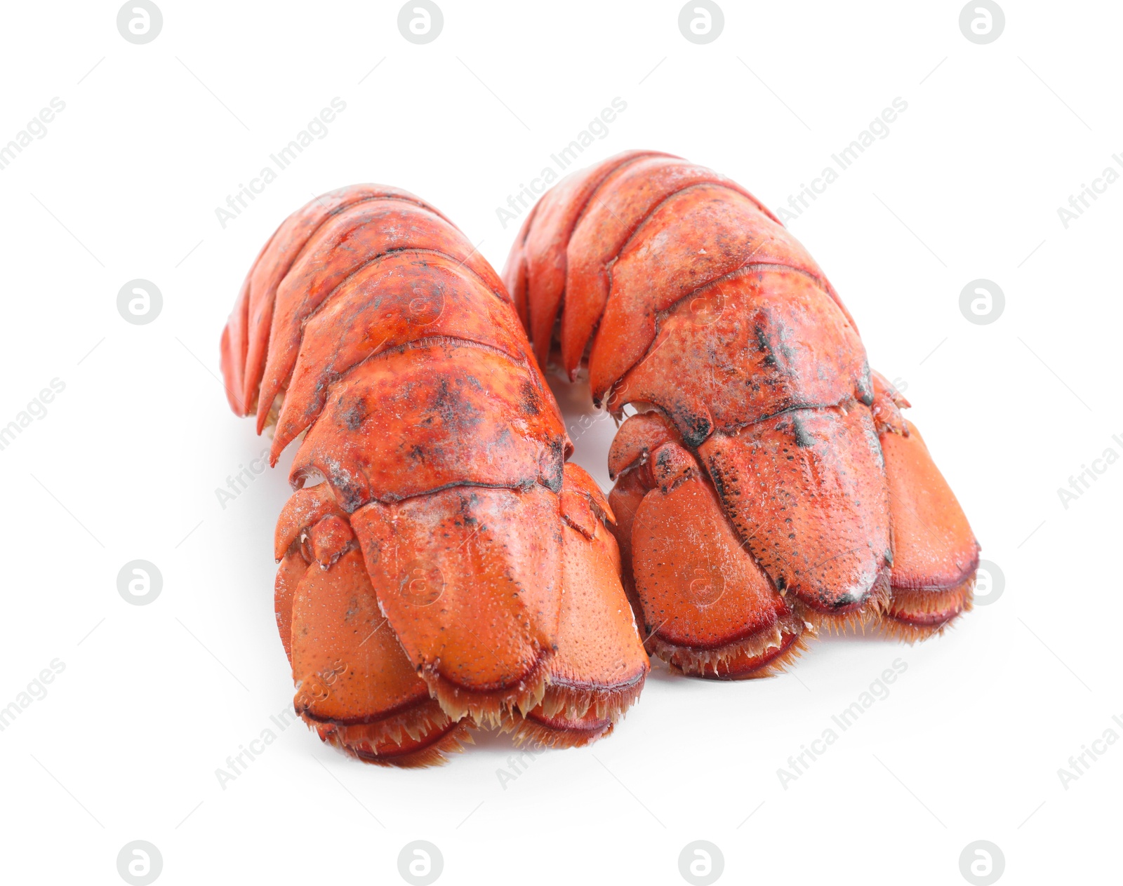 Photo of Tails of boiled lobsters isolated on white