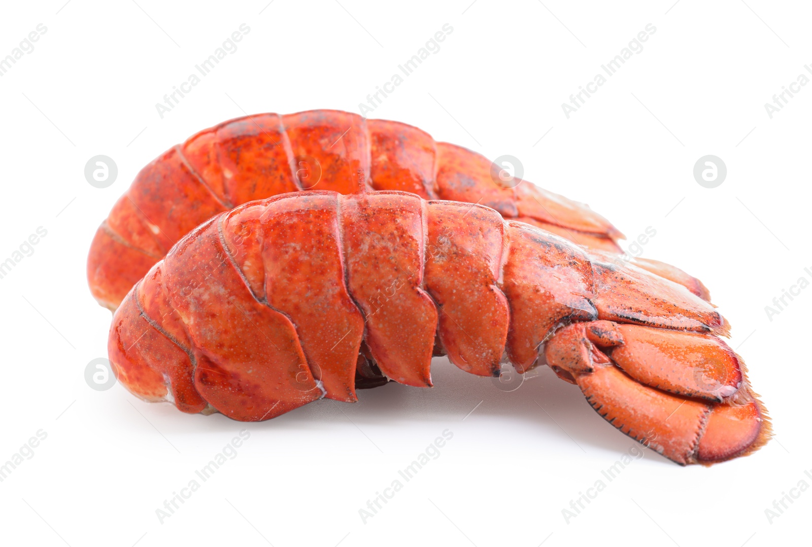 Photo of Tails of boiled lobsters isolated on white