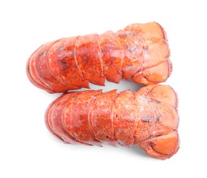 Photo of Tails of boiled lobsters isolated on white, top view